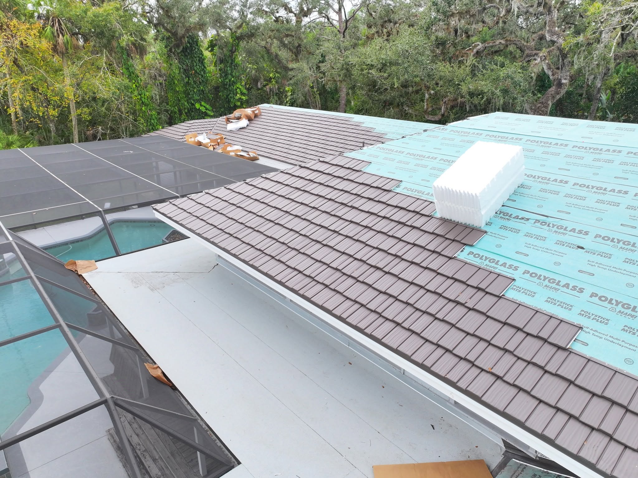 underlayment and metal shake shingle roofing system